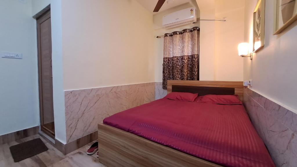 Ein Bett oder Betten in einem Zimmer der Unterkunft Laxmi Niwas, Salt Lake, Kolkata, 10mins from Sector 5