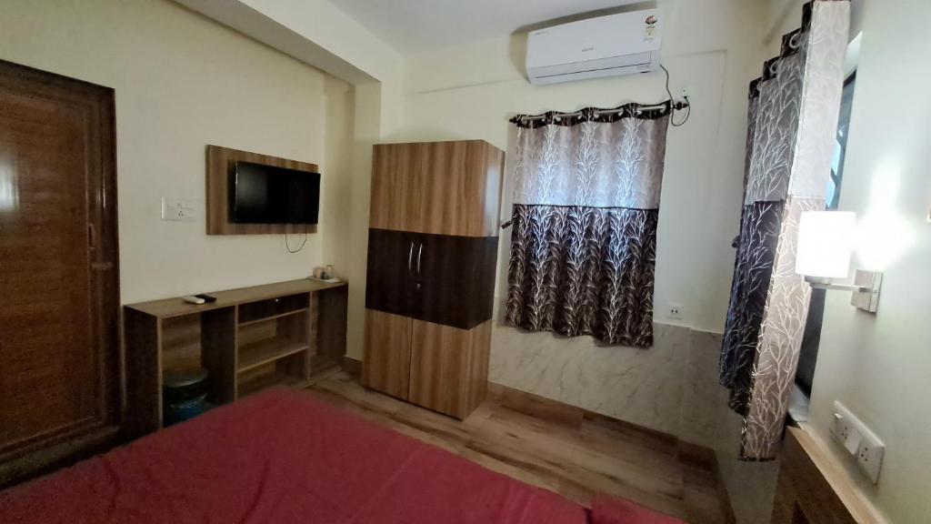 Ein Bett oder Betten in einem Zimmer der Unterkunft Laxmi Niwas, Salt Lake, Kolkata, 10mins from Sector 5
