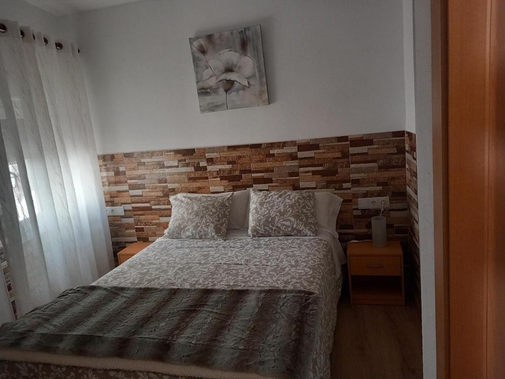 A bed or beds in a room at Apartamento Plano Royo 2º