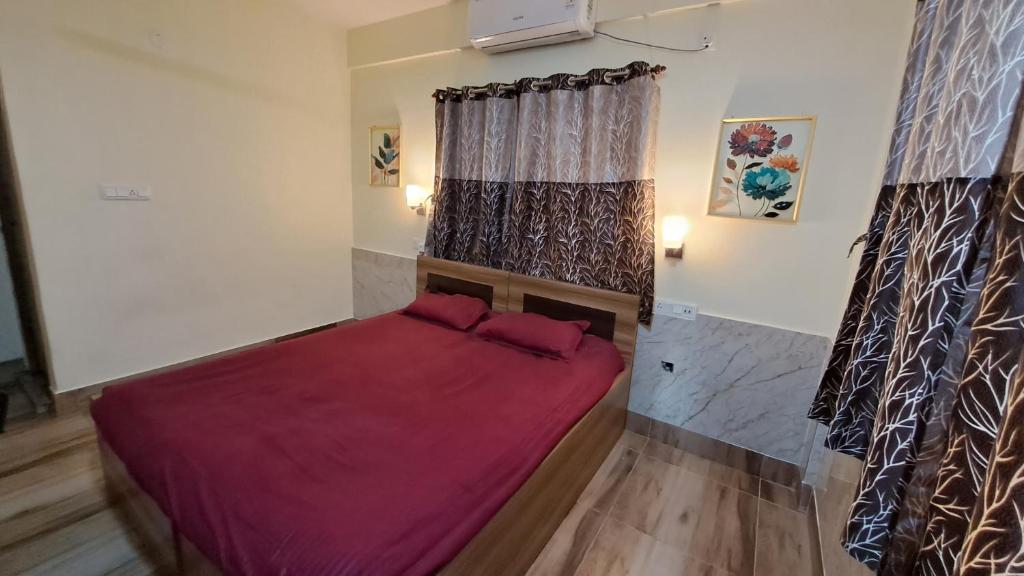 Ein Bett oder Betten in einem Zimmer der Unterkunft Laxmi Niwas, Salt Lake, Kolkata, 10mins from Sector 5