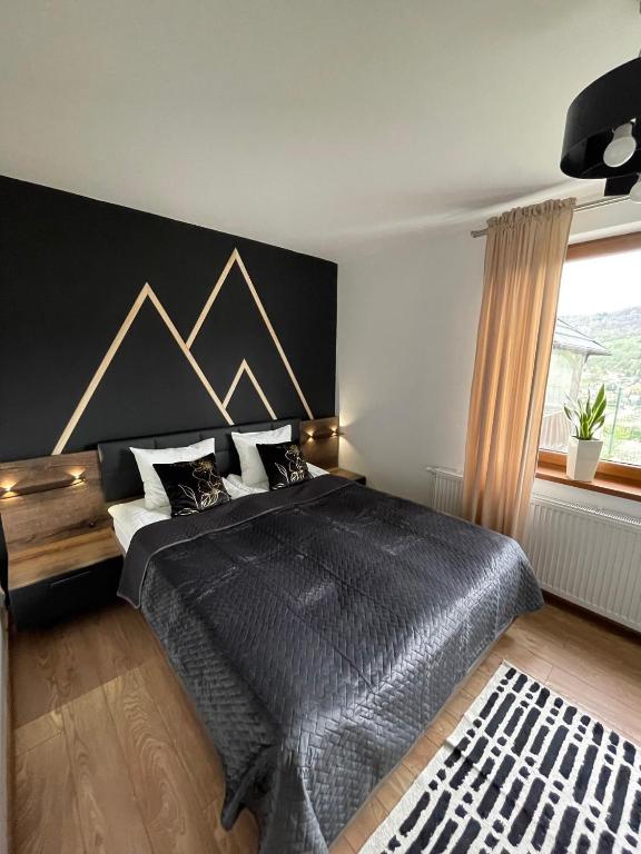 Posteľ alebo postele v izbe v ubytovaní Apartamenty ''Chcę Tu Zostać''