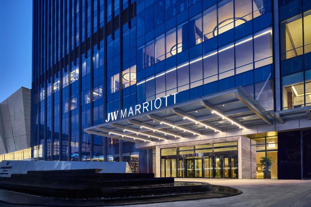 a building with a sign on the side of it at JW Marriott Hotel Taiyuan in Taiyuan