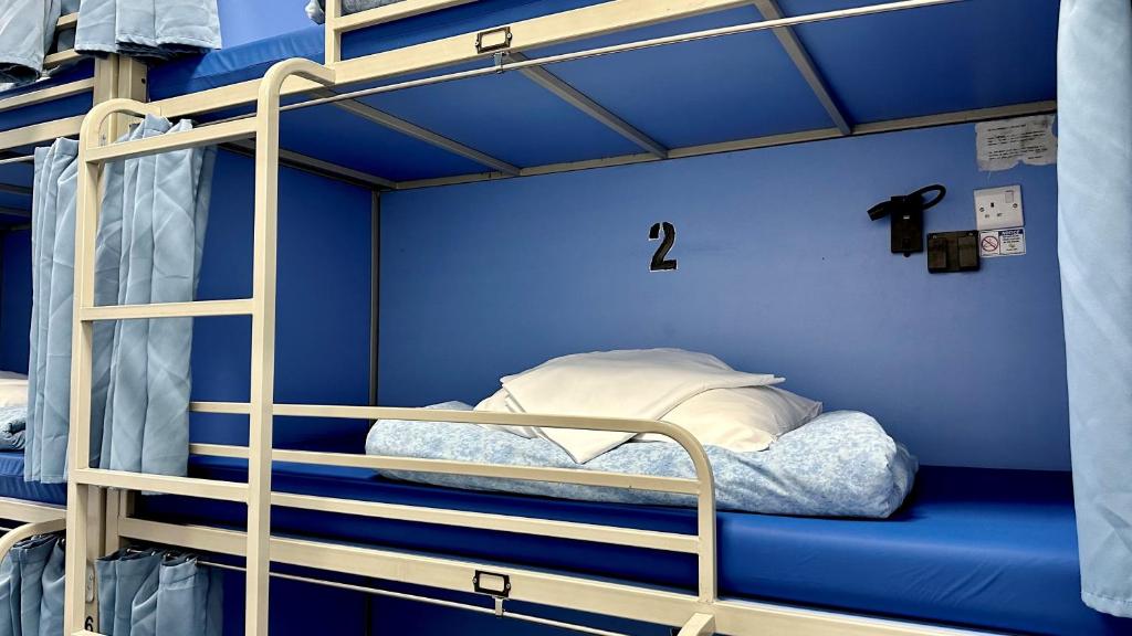 Postel nebo postele na pokoji v ubytování Smart Hyde Park Inn