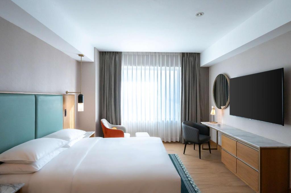 Postel nebo postele na pokoji v ubytování Hyatt Regency Nairobi Westlands