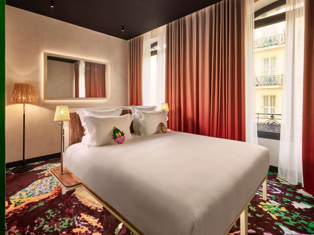 Ένα ή περισσότερα κρεβάτια σε δωμάτιο στο Mama Shelter Nice