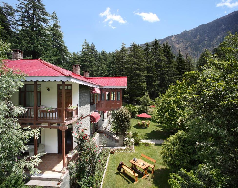 an aerial view of a house with a garden at Bedzzz Xclusiv Baikunth, Manali By Leisure Hotels - 650 meters from Hidimba Devi Temple in Manāli