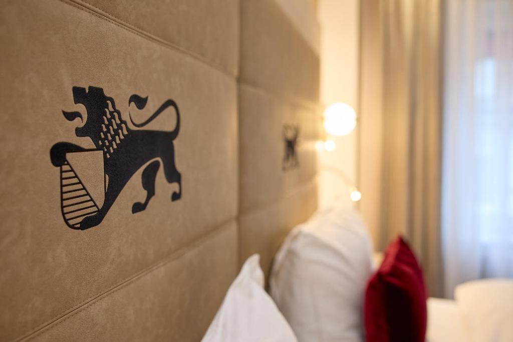 a wall with a sticker of a lion on it at Hotel St.Gotthard in Zürich