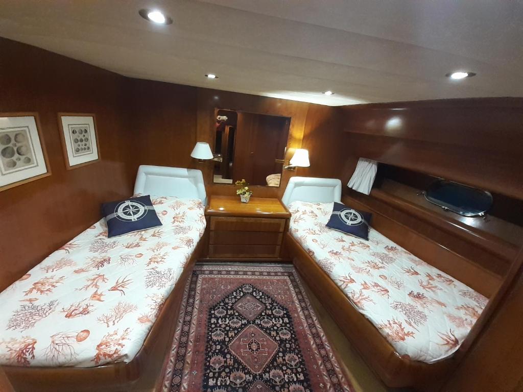 a small room with two beds in a boat at Felicita in Marina di Portisco