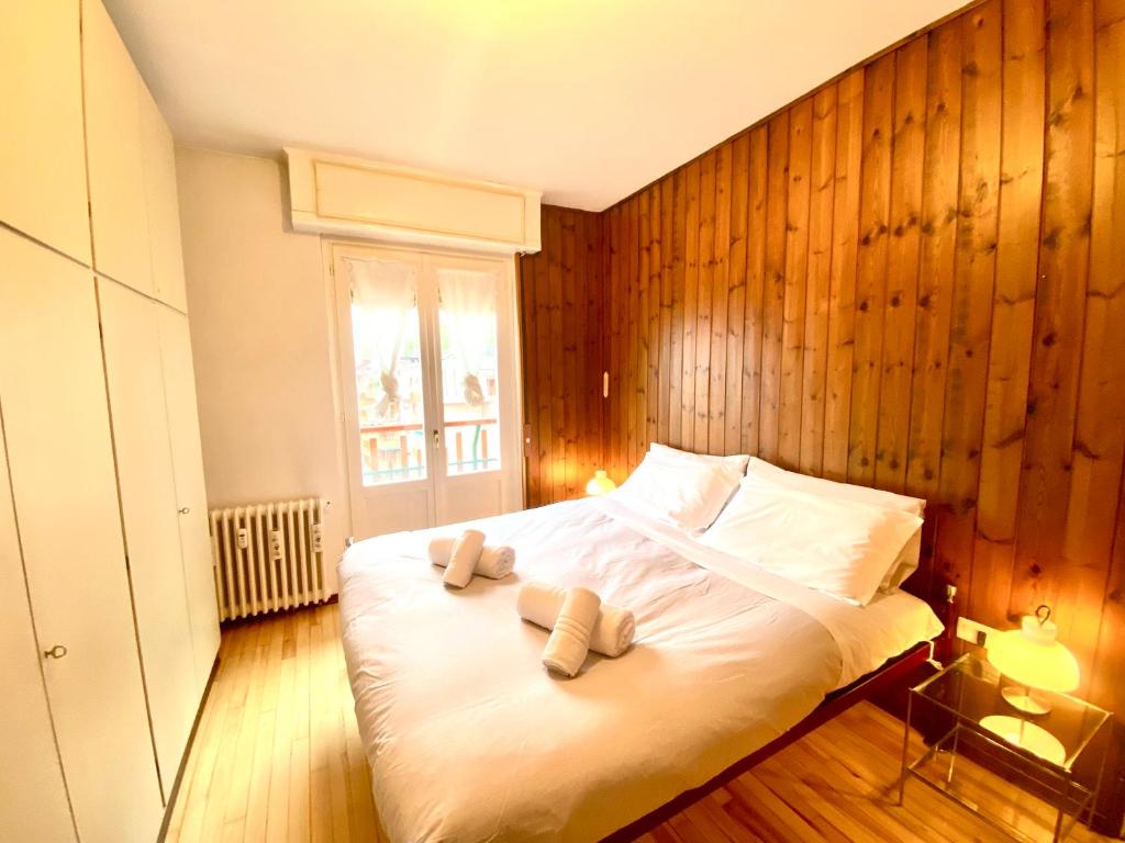 a bedroom with a bed with two towels on it at Mountain apartment with marvelous view near slopes in Barzio