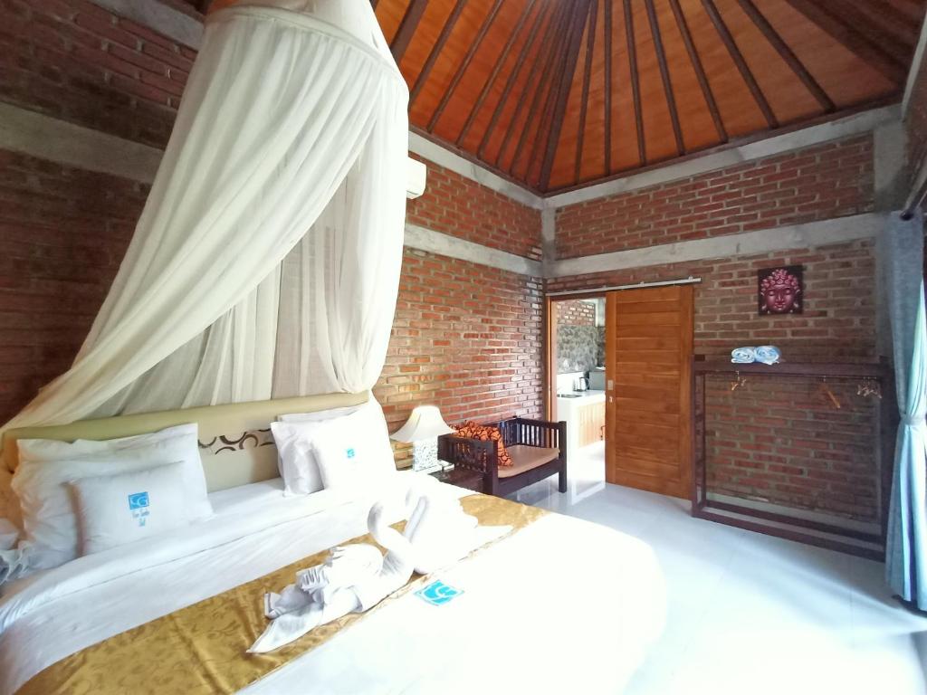 Postel nebo postele na pokoji v ubytování Coco Garden Pool Villas