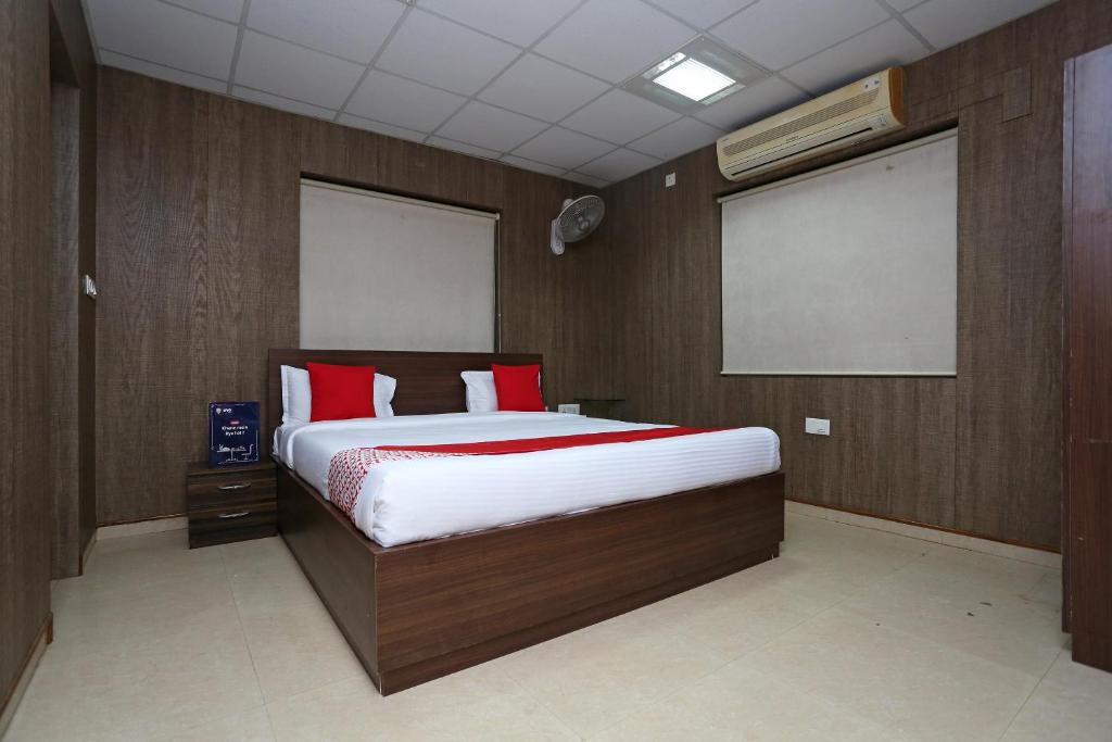 Ένα ή περισσότερα κρεβάτια σε δωμάτιο στο Super OYO Flagship 11659 Kalinga Regency