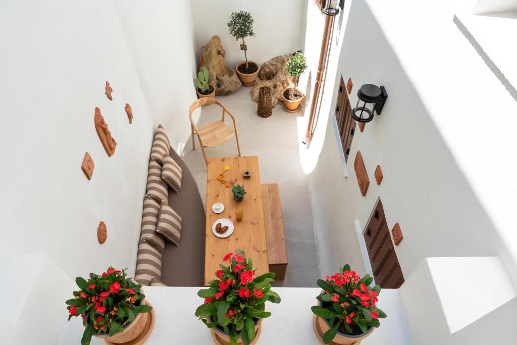 an overhead view of a living room with potted plants at Rodos Old Town Aqua Luxury Suites in Rhodes Town
