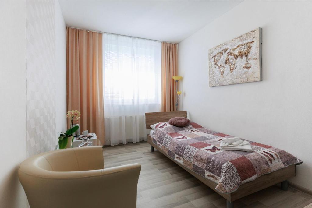 Postel nebo postele na pokoji v ubytování Agro Complex Apartments