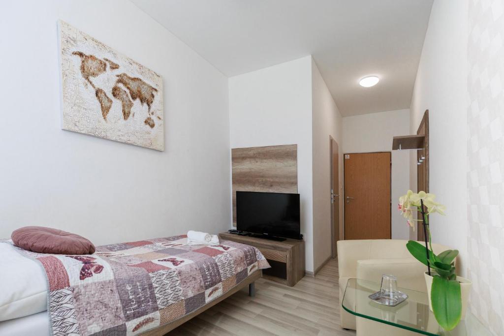 Postel nebo postele na pokoji v ubytování Agro Complex Apartments