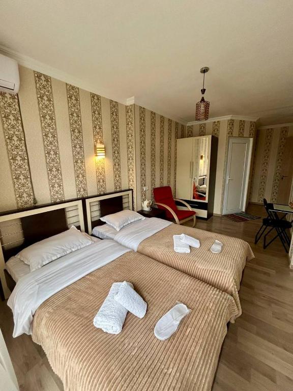 Postel nebo postele na pokoji v ubytování Hotel Marioni