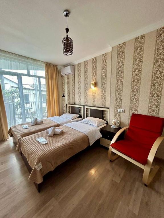 Postel nebo postele na pokoji v ubytování Hotel Marioni