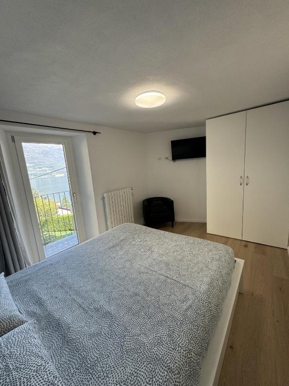 Postel nebo postele na pokoji v ubytování Bellano Holidays - Casa Artemio