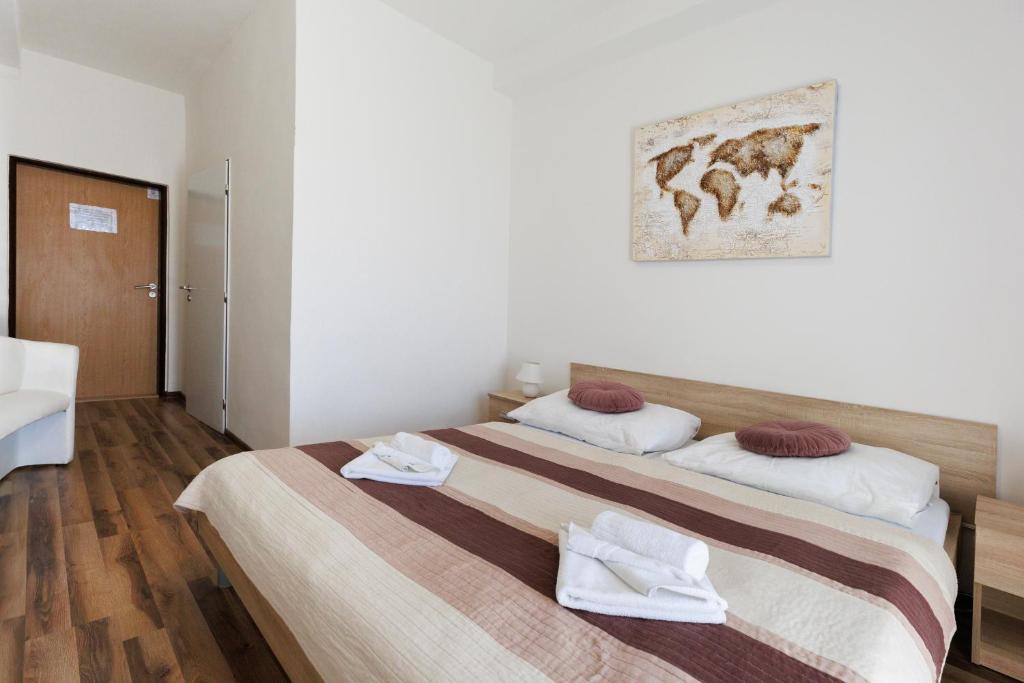 Postel nebo postele na pokoji v ubytování Agro Complex Apartments