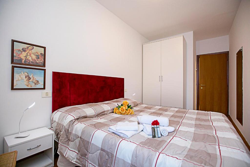 Posteľ alebo postele v izbe v ubytovaní Appartamento Centro Storico Riva 2 - Happy Rentals