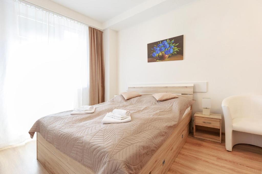 Postel nebo postele na pokoji v ubytování Agro Complex Apartments