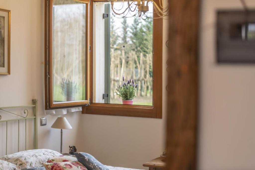 Postel nebo postele na pokoji v ubytování Agriturismo Al Botteniga