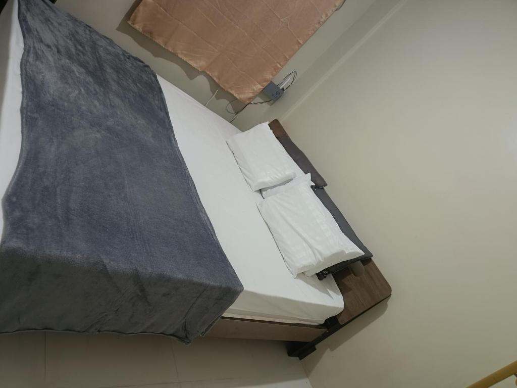 En eller flere senge i et værelse på Guest staying