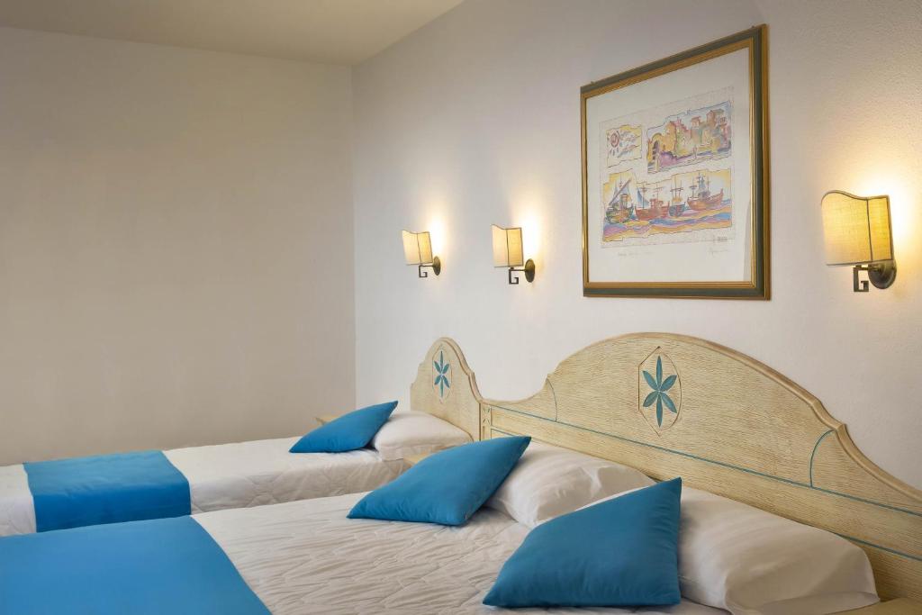 Postel nebo postele na pokoji v ubytování Hotel Villa Campana