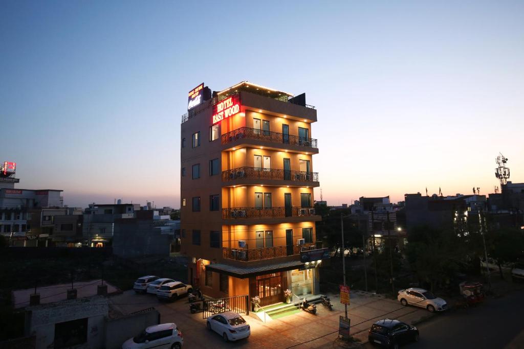 a tall building with lights on top of it at Hotel East Wood Amritsar in Amritsar