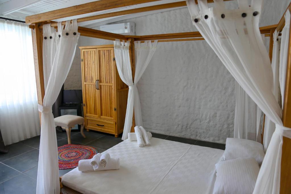 Postel nebo postele na pokoji v ubytování Rikas Boutique Otel