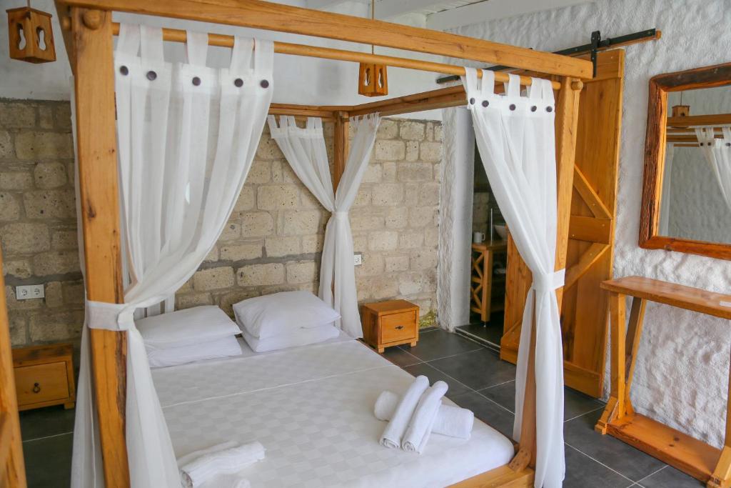 Postel nebo postele na pokoji v ubytování Rikas Boutique Otel