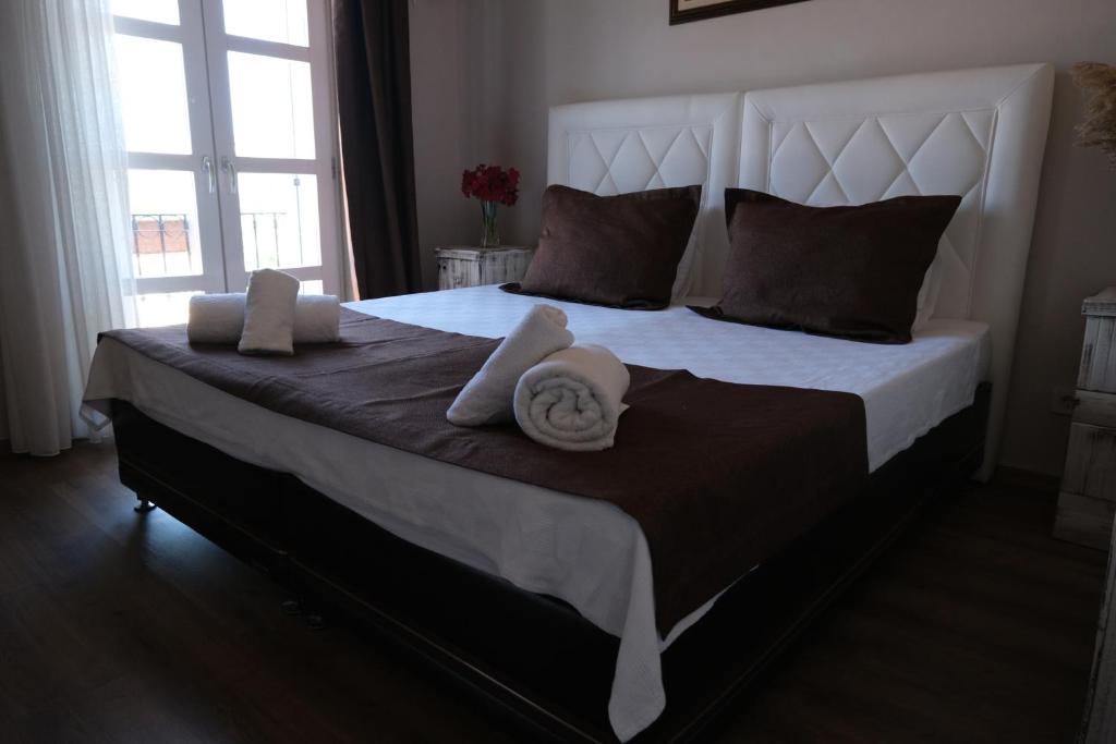 Postel nebo postele na pokoji v ubytování Rikas Boutique Otel