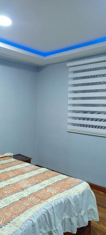 Postel nebo postele na pokoji v ubytování Suite Privada Riobamba