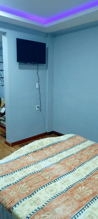 Postel nebo postele na pokoji v ubytování Suite Privada Riobamba