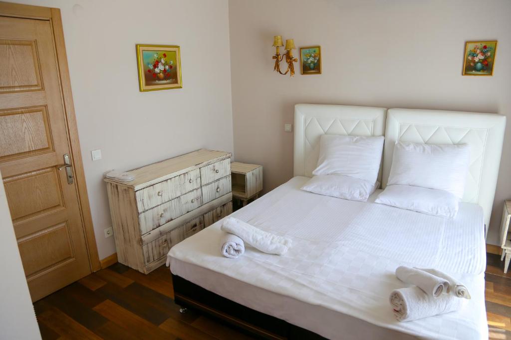 Postel nebo postele na pokoji v ubytování Rikas Boutique Otel