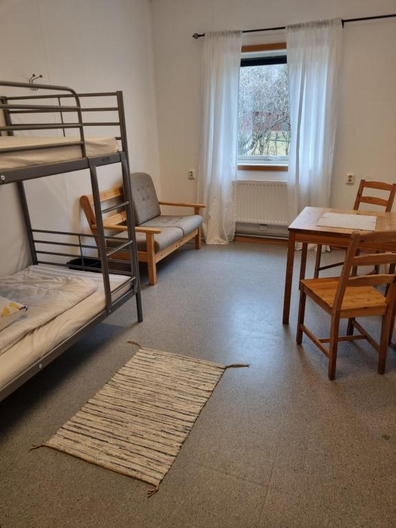 Postel nebo postele na pokoji v ubytování Torsby Vandrarhem