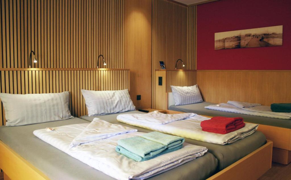 Postel nebo postele na pokoji v ubytování neyland apartments Norderney