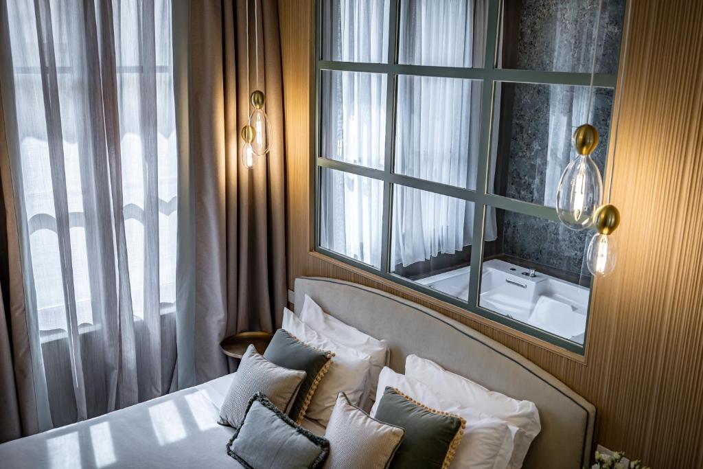 Postel nebo postele na pokoji v ubytování Hotel La Scaletta al Ponte Vecchio