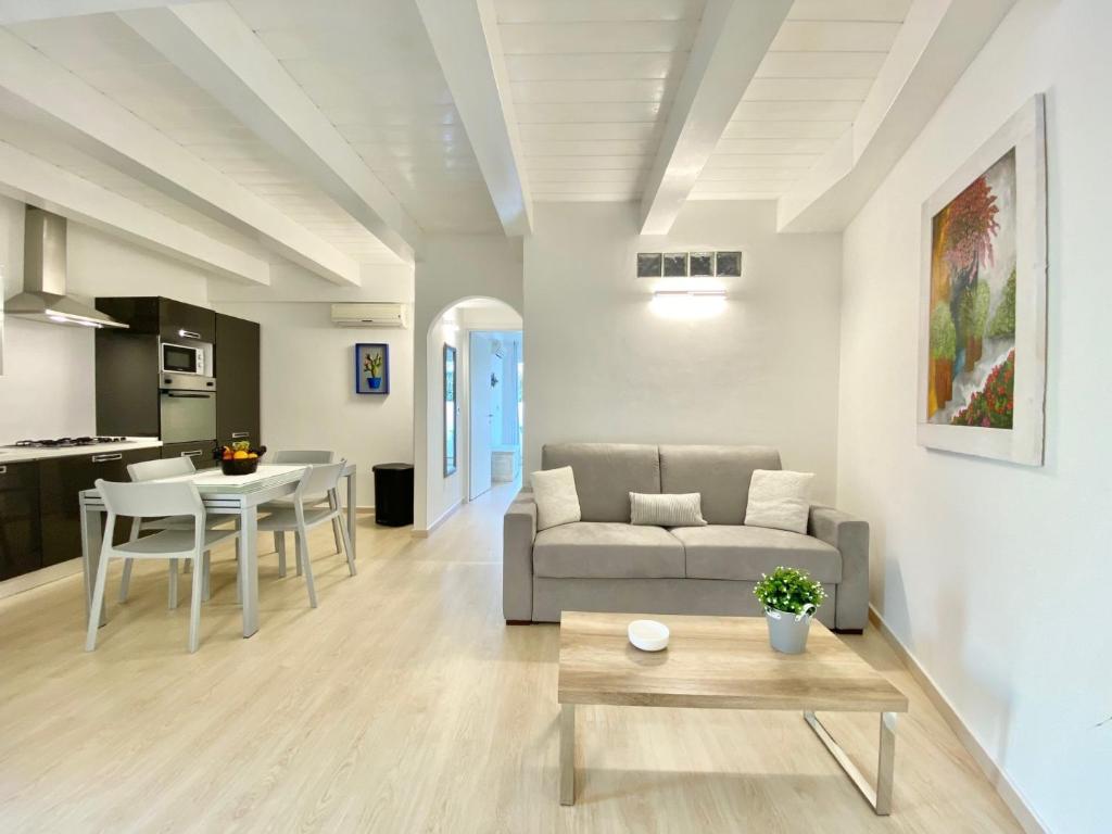 a living room with a couch and a table at Guendalina in Santa Teresa Gallura