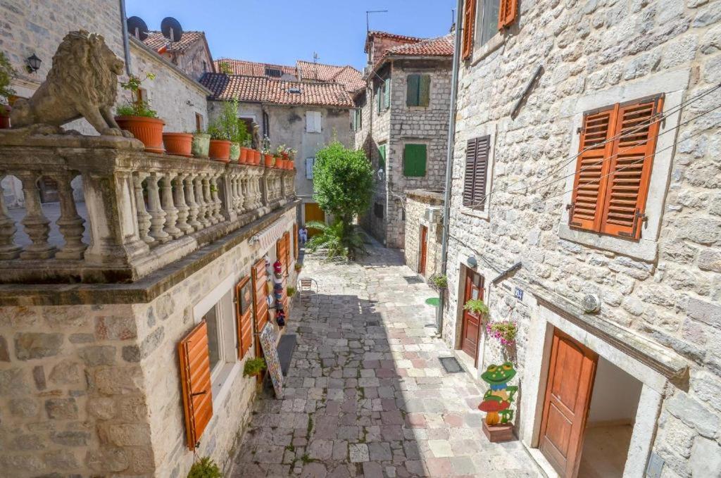 an alley in an old town with buildings at Majka 2 Apartments in Kotor