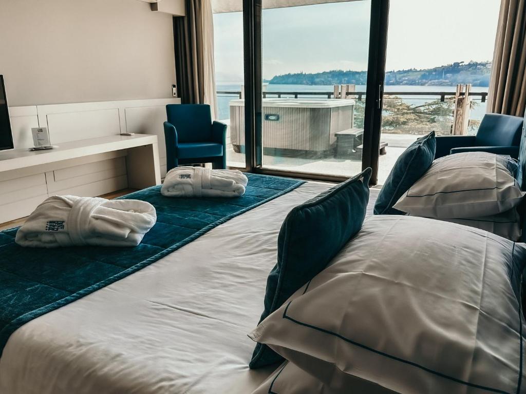 Postel nebo postele na pokoji v ubytování Hotel Salò du Parc
