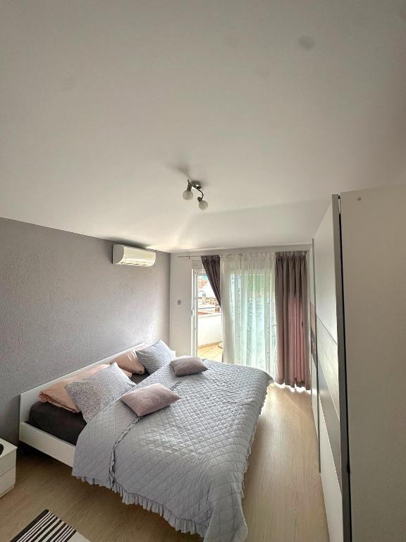 Postel nebo postele na pokoji v ubytování Vila Damir
