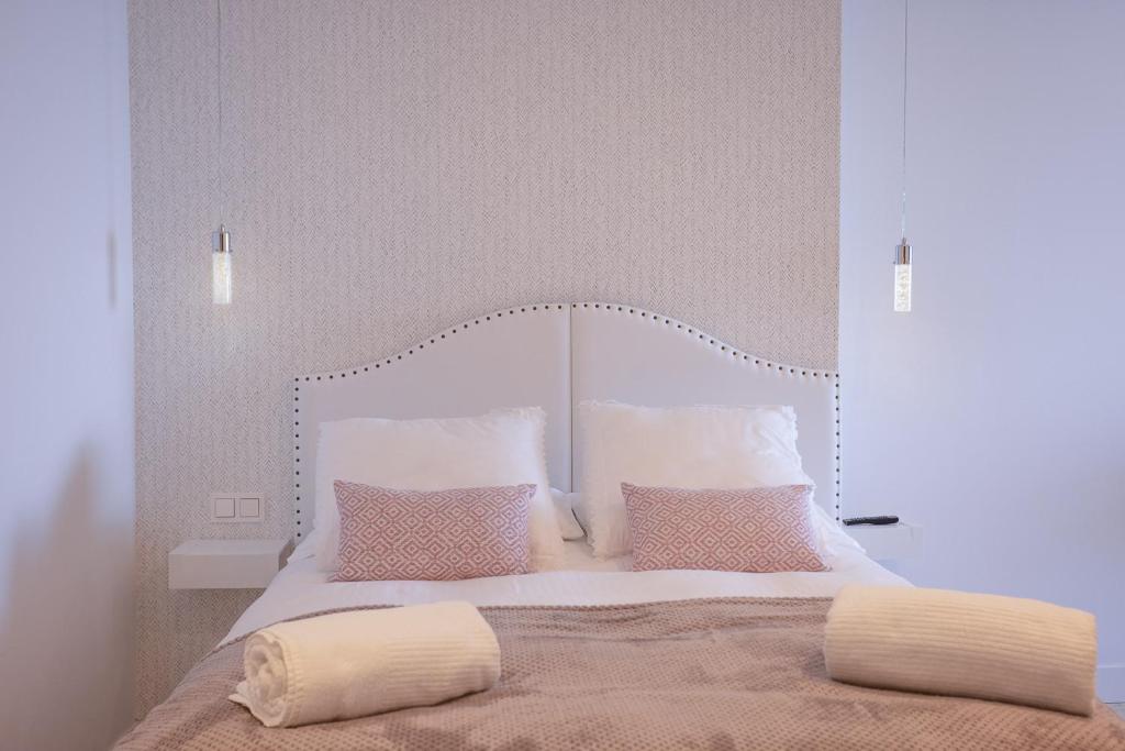 Posteľ alebo postele v izbe v ubytovaní APARTAMENTOS KRESALA - Vistas al mar