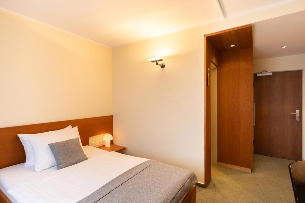 Postel nebo postele na pokoji v ubytování Select Hotel Silence Garden Köln