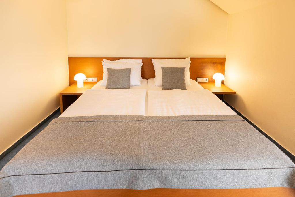 Postel nebo postele na pokoji v ubytování Select Hotel Silence Garden Köln