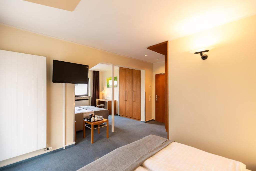 TV a/nebo společenská místnost v ubytování Select Hotel Silence Garden Köln
