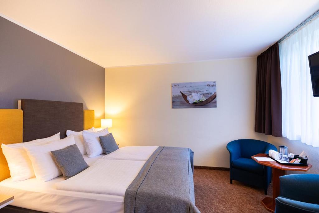 Postel nebo postele na pokoji v ubytování Select Hotel Silence Garden Köln