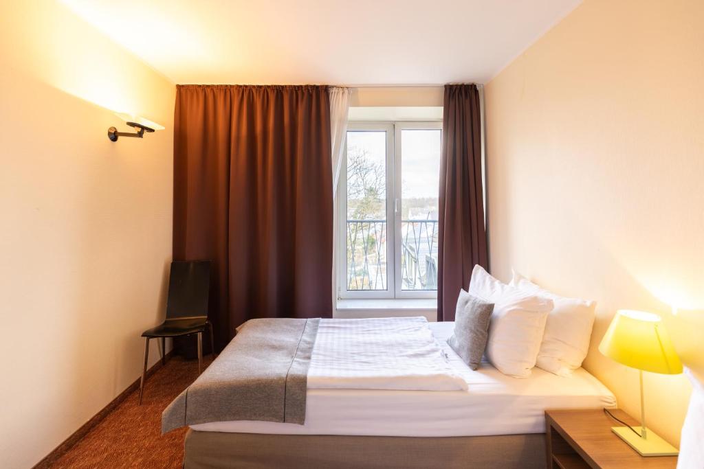 Postel nebo postele na pokoji v ubytování Select Hotel Silence Garden Köln