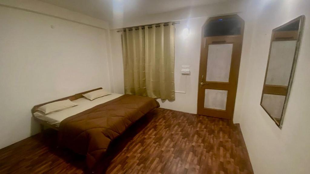 Letto o letti in una camera di Nomadic Den Manali