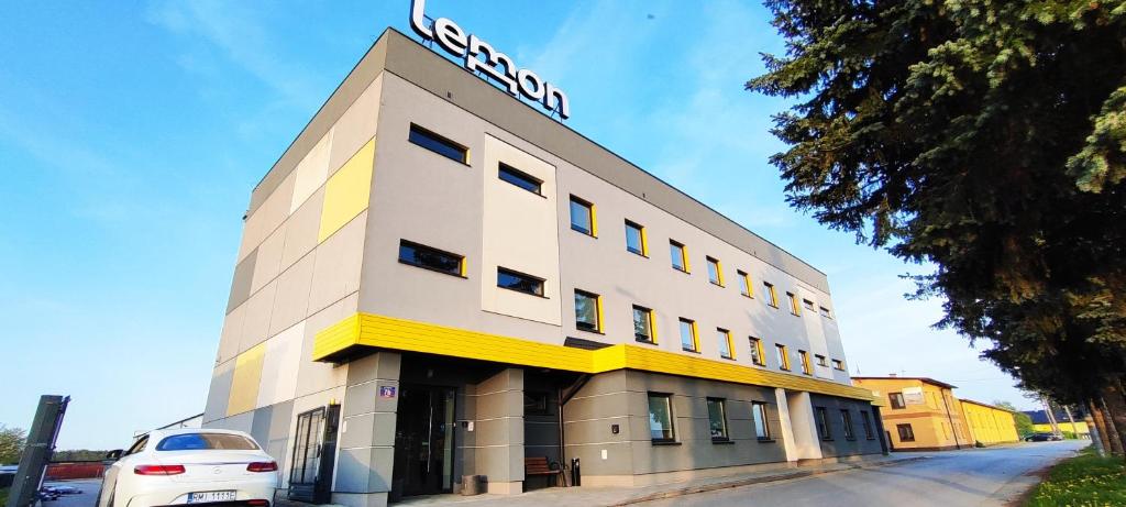 a building with a sign on the top of it at lemon in Mielec