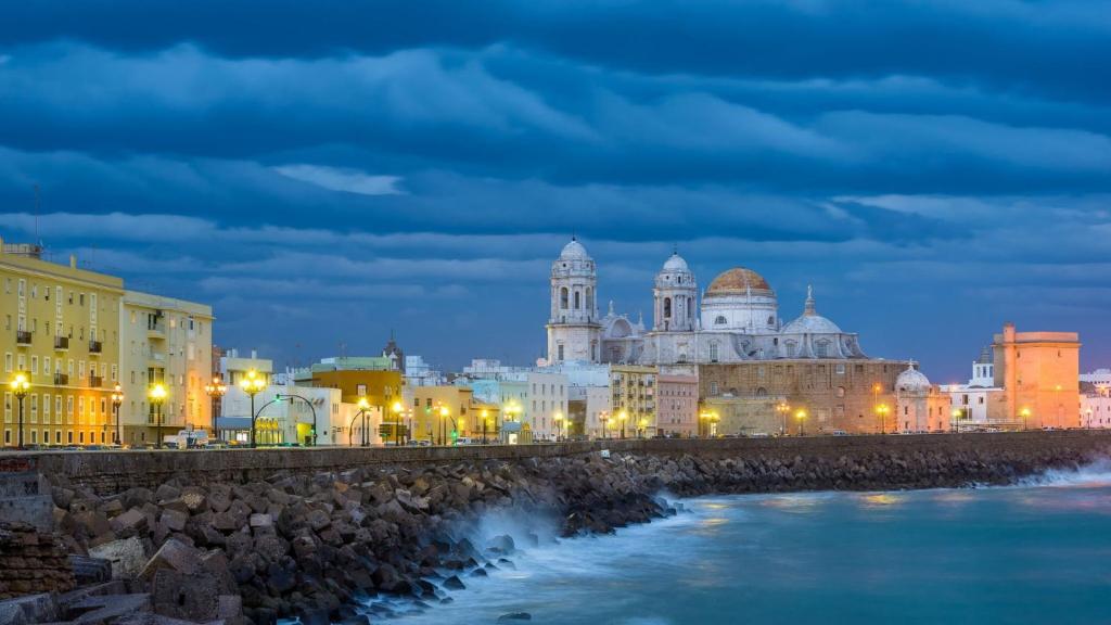 a view of a city at night at Casa Trajano Grupo AC Gestion in Cádiz